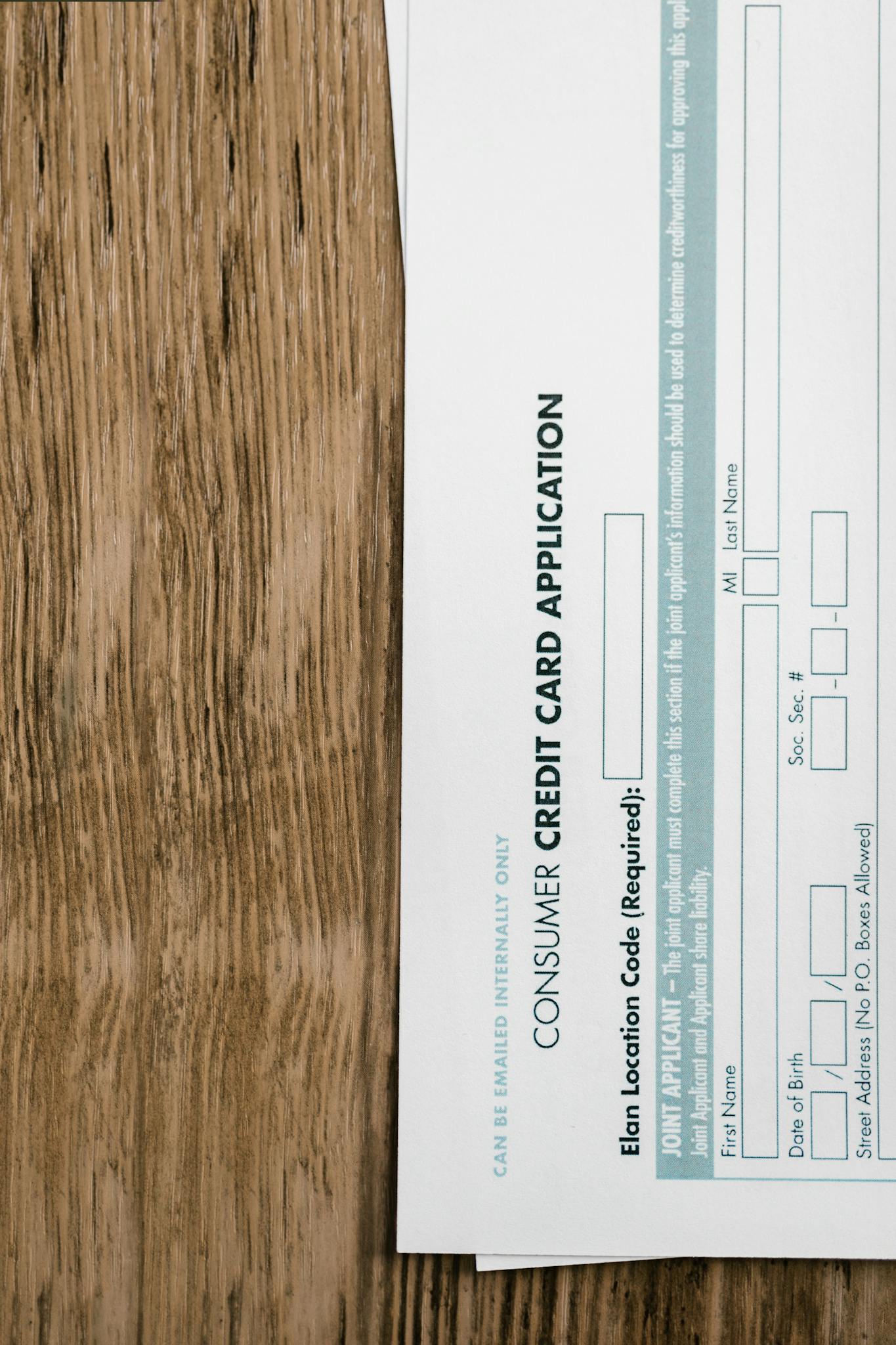 White Paper Document on Brown Wooden Table